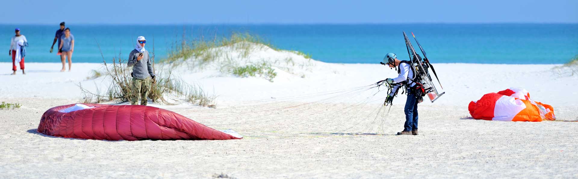 Man Parasailing on Florida Beach