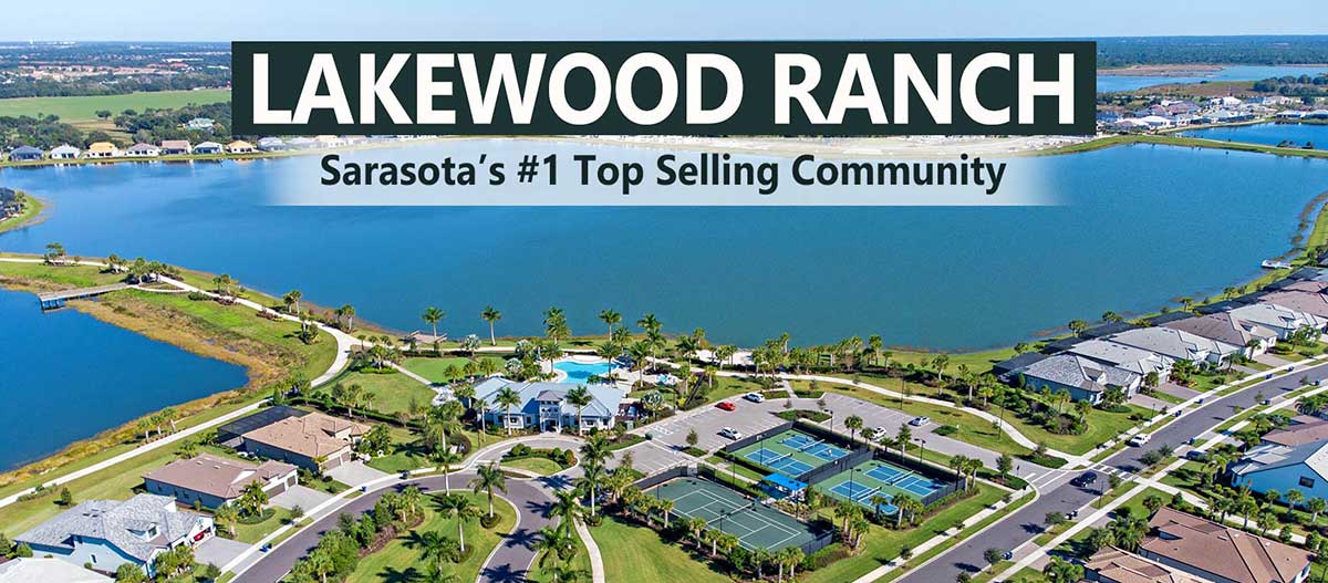 Aerial view of a Lakewood Ranch community with clubhouse, homes and a large lake